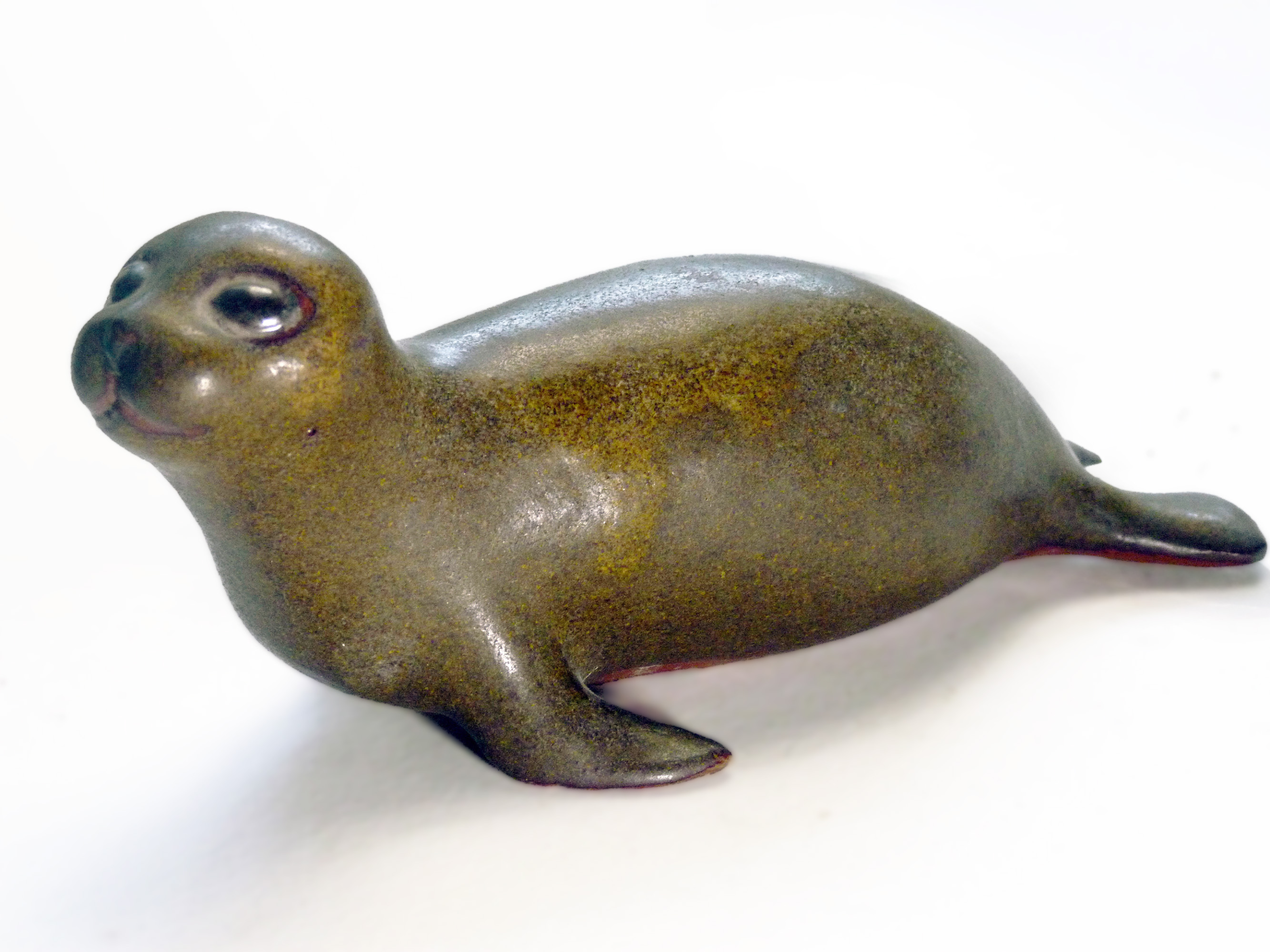 Vintage Baby Seal Early designed by Weston and Brenda Andersen is the early version with wide eyes and short nose., Glazed in rare vintage brown glaze designed by Weston. Eyes ebony. Slip cast in red body. All handcrafted in America, 7 inches long