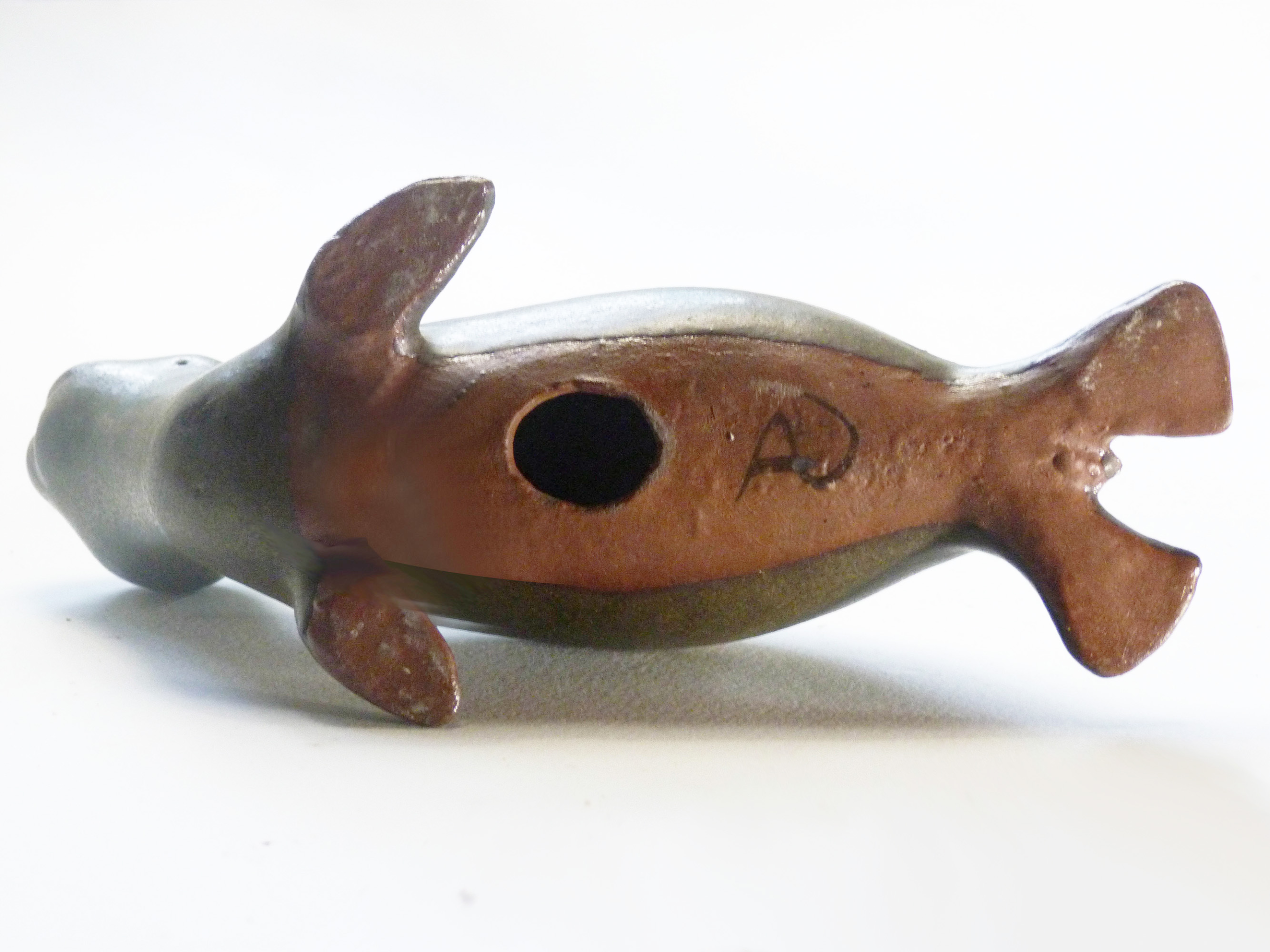 Vintage Baby Seal Early designed by Weston and Brenda Andersen is the early version with wide eyes and short nose., Glazed in rare vintage brown glaze designed by Weston. Eyes ebony. Slip cast in red body. All handcrafted in America, 7 inches long