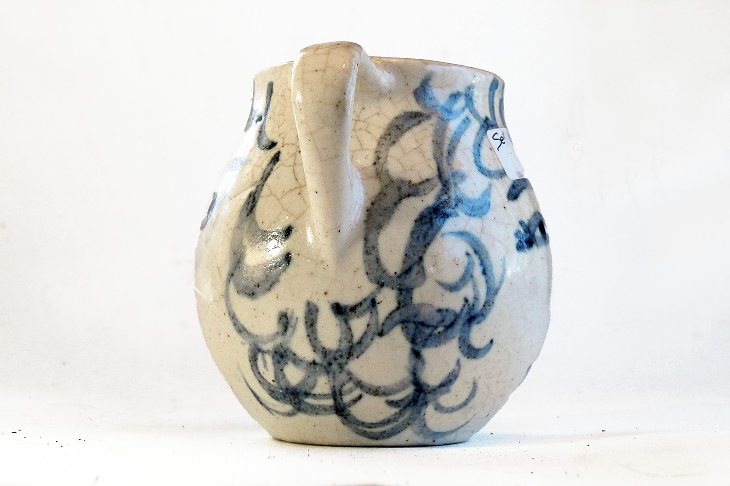 This is a one-of-a-kind mug that is part of a series of seven mugs that Brenda decorated. The mugs are delicately cast. The lip diameter is 2 inches. The body is 3.5 inches tall and wide. Out of this series of mugs, one mug is a portrait of a real person, myself, I call this mug Blue Sweet Sue, because my first name is Susan, and because one side of the mug is blue and the other sweet. I frequently sat alongside my mother when she decorated.