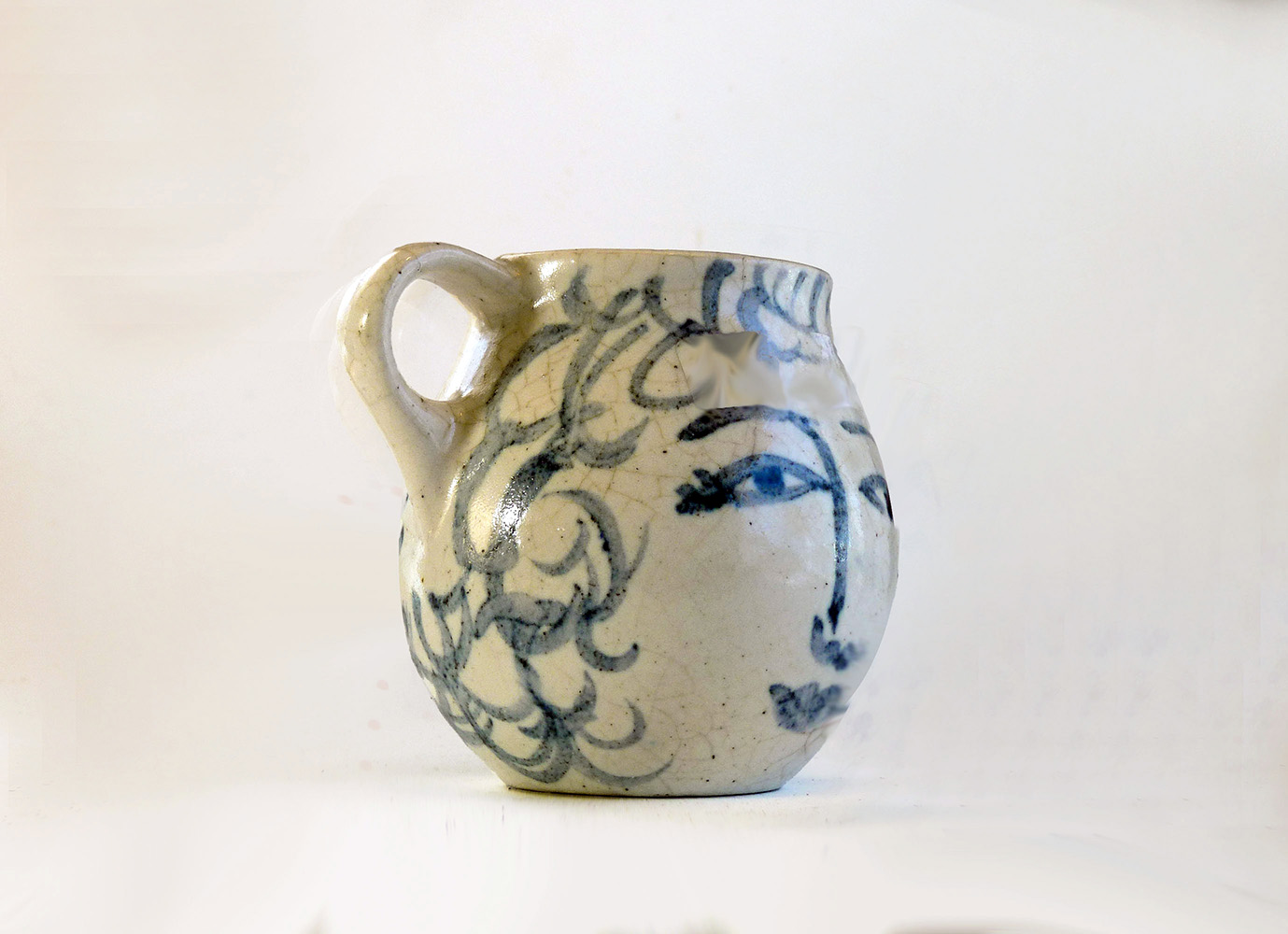 This is a one-of-a-kind mug that is part of a series of seven mugs that Brenda decorated. The mugs are delicately cast. The lip diameter is 2 inches. The body is 3.5 inches tall and wide. Out of this series of mugs, one mug is a portrait of a real person, myself, I call this mug Blue Sweet Sue, because my first name is Susan, and because one side of the mug is blue and the other sweet. I frequently sat alongside my mother when she decorated.