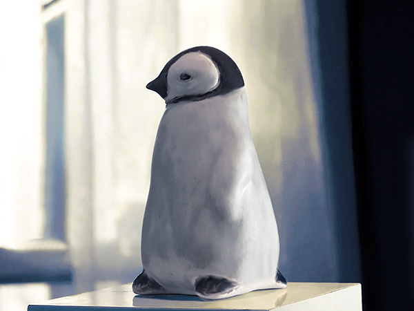 Baby Penguin Sculpture, 5 inches tall, Gray ceramic decorating color flows down the form creating variations in tone. A glossy ebony contrasts with the white matte glaze around the eyes. The Ceramic Baby Penguin is slip-cast in white stoneware and hand-crafted by American artisans,